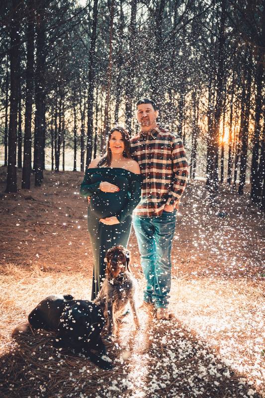 Family with their dog in a pine forest