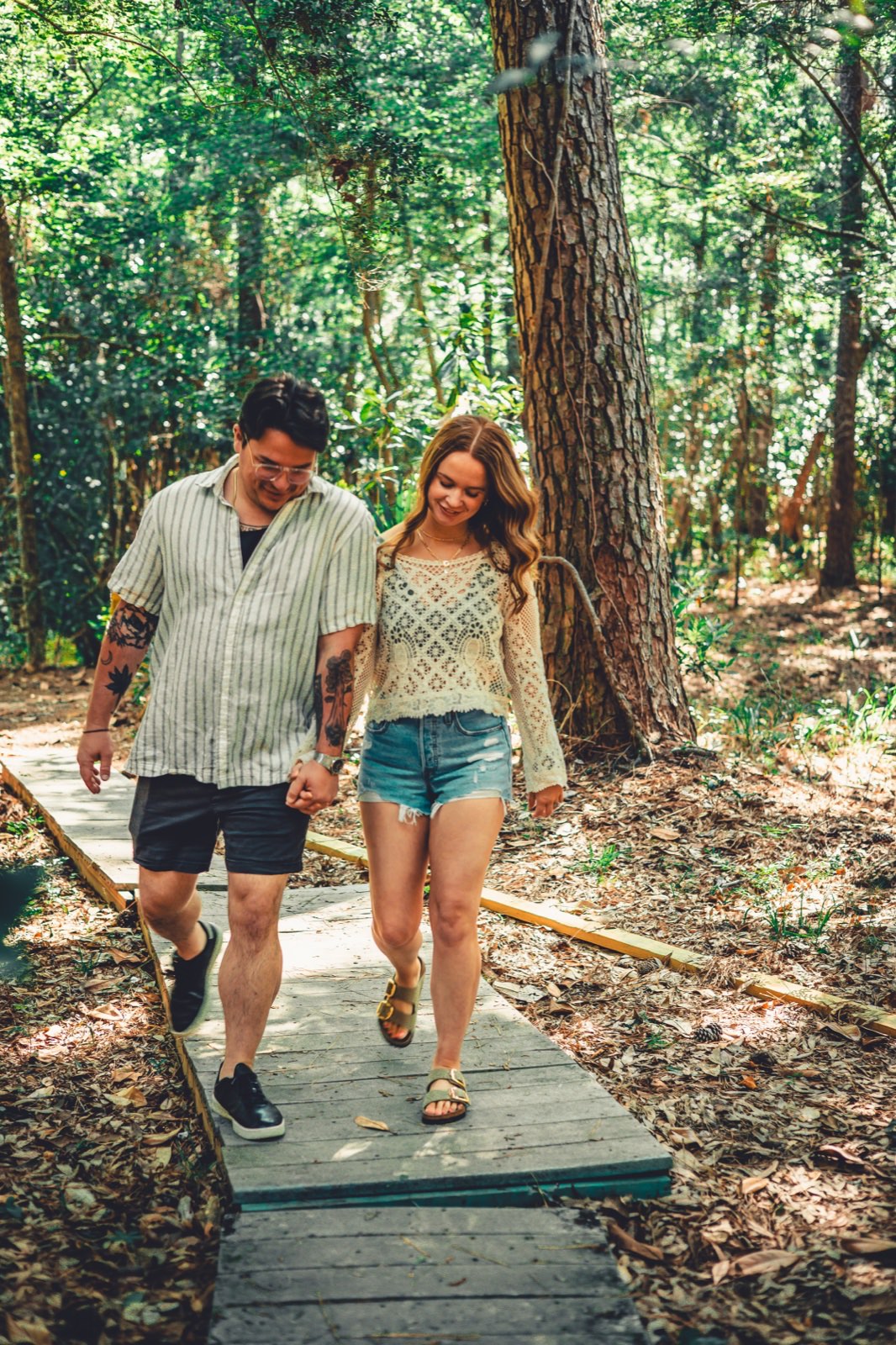 Keegan Sullivan and his wife walking through the woods, by Sullivan Creative Co., Greenville SC